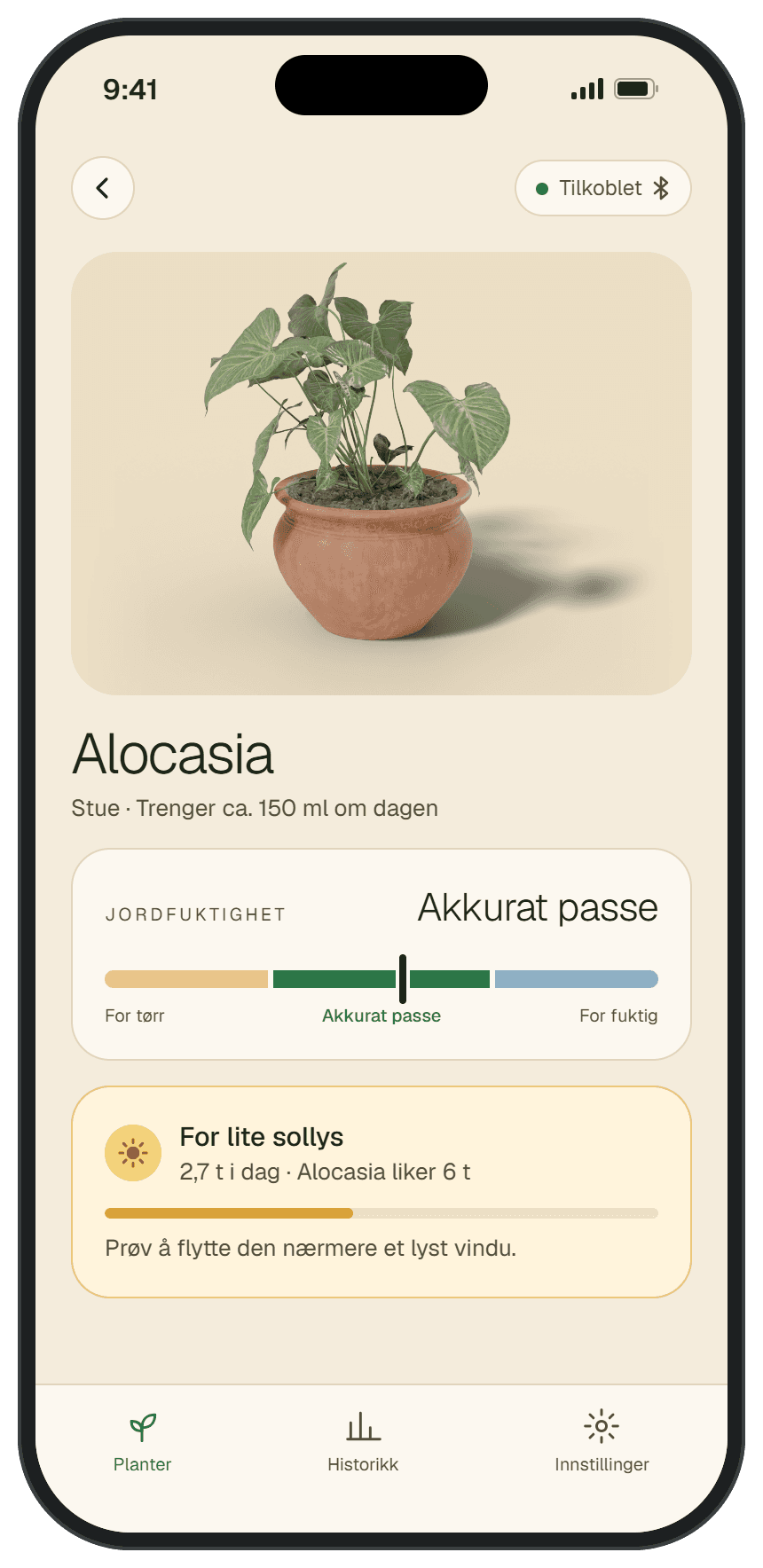 Plantegreia-appen viser at jordfuktigheten til en Alocasia er akkurat passe, og varsler om at den får for lite sollys